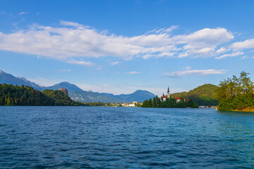 Church of the Assumption of the Virgin Mary on an island near Lake Bled in Slovenia. There are beautiful clouds in the sky.