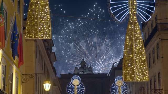 Fireworks over the historic Rua Augusta Arch during New Years Eve 2023 celebrations in Lisbon, Portugal. 