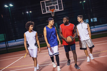 Guys playing basketball - Powered by Adobe