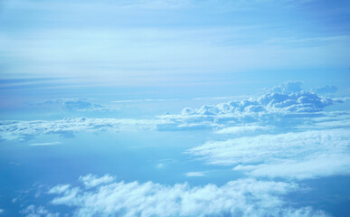 Floating clouds following the wind viewed from airplane height