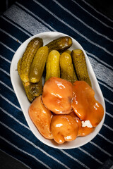 Pickled saffron mushrooms and canned cucumbers.