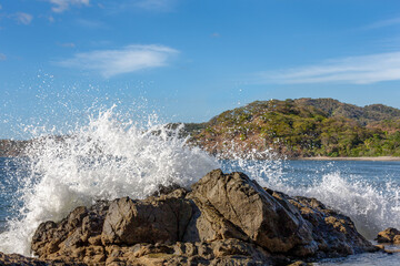 Wave Crashing into a Rock with Copy Space - 701458663