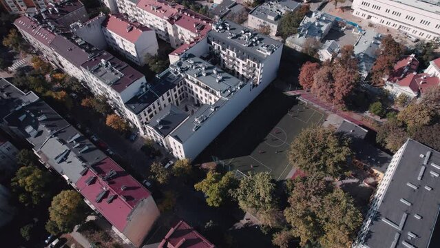 A Spirited Football Game Takes Center Stage Amongst Beautiful Old Tenement Houses in Warsaw's old Praga Districts
