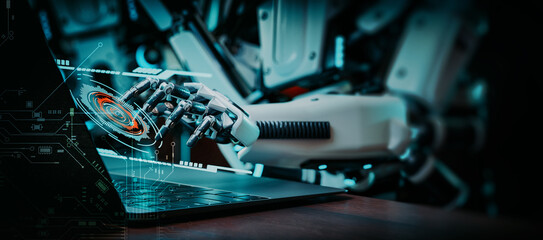 Image of a group of robots working on a computer.