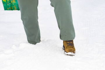 Fototapeta na wymiar foot in a snowdrift. close-up