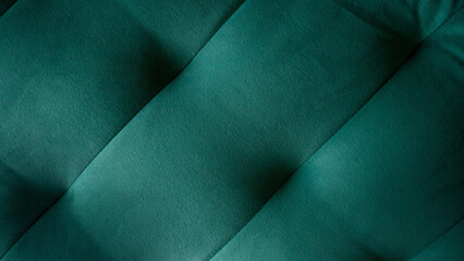 The texture of the expensive fabric. Green background