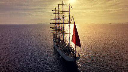 Aerial drone photo of beautiful three mast barque or barc type classic sailing wooden boat with...