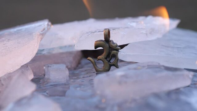 Buddhism om sign on ice burns in fire and melts ice