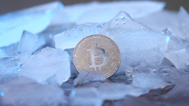 frozen bitcoin on ice burns in fire and melts ice. bitcoin growth concept
