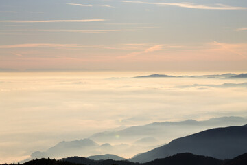 Mountain peaks emerging from the clouds