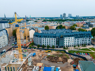 aerial view of construction progress in urban neighborhood with landscaped areas