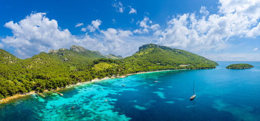 Aerial view Cala Formentor serene beauty, with its white sands, clear turquoise waters, and lush...