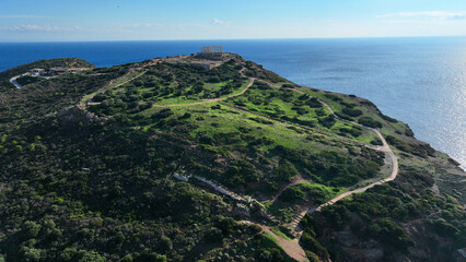 Aerial drone photo of iconic archaeological site of Cape Sounio and famous Temple of Poseidon built...