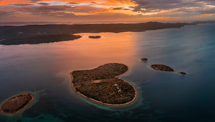 Galesnjak, Croatia - Aerial panoramic view of the beautiful heart-shaped island Galesnjak with a colorful golden summer sunset above the Adriatic mediterranean sea in Dalmatia region