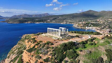 Aerial drone photo of iconic archaeological site of Cape Sounio and famous Temple of Poseidon built...