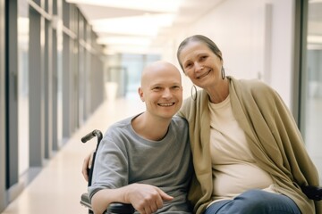 Man with cancer with his mother in hospital on wheelchair