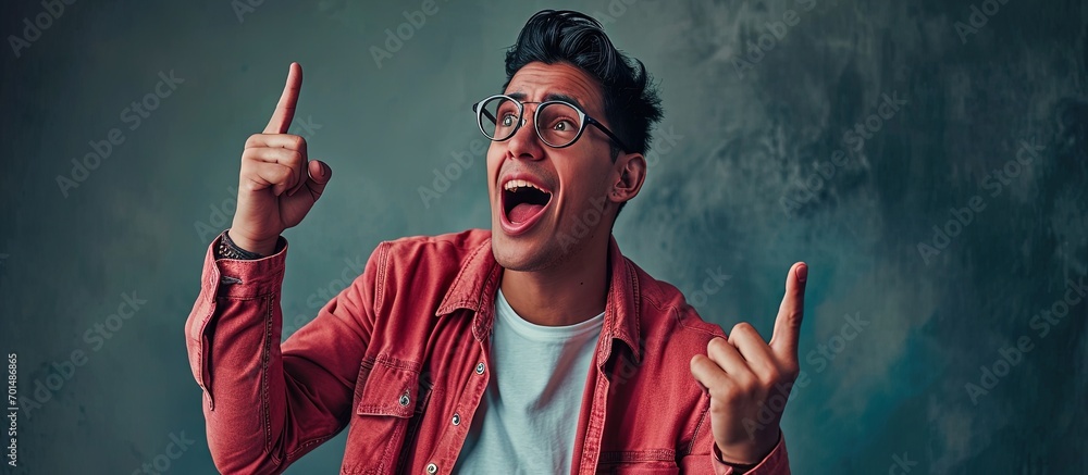 Aufkleber middle age latin man wearing casual clothes and glasses pointing with finger surprised ahead open mo