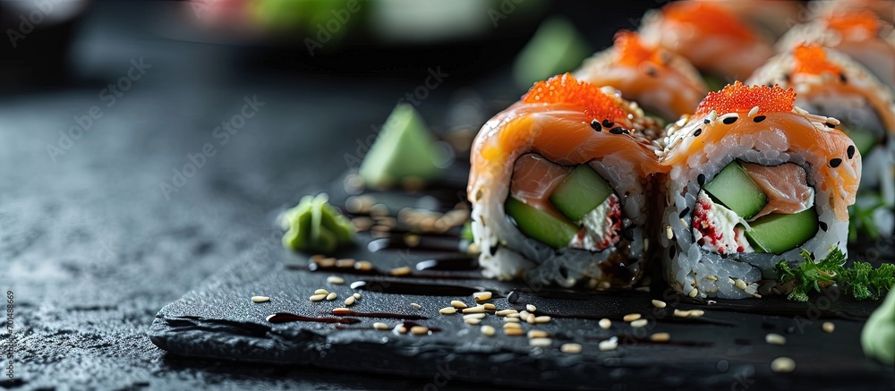 Poster sushi rolls close up with salmon avocado and cucumber. creative banner. copyspace image