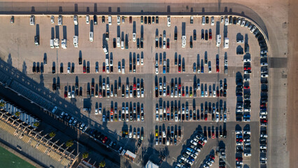 Parking photography. Aerial view of the car parking in a shopping center. Cars online.