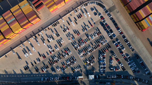 Parking photography. Aerial view of the car parking in a shopping center. Cars online.