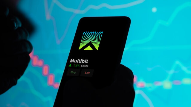 January 1st 2023. An investor analyzing the price of Multibit on a screen, the token coin $MUBI on a crypto exchange sreen.