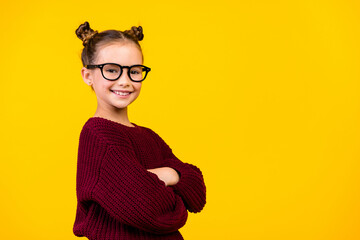 Profile portrait of cheerful clever girl crossed arms toothy smile empty space ad isolated on yellow color background - obrazy, fototapety, plakaty