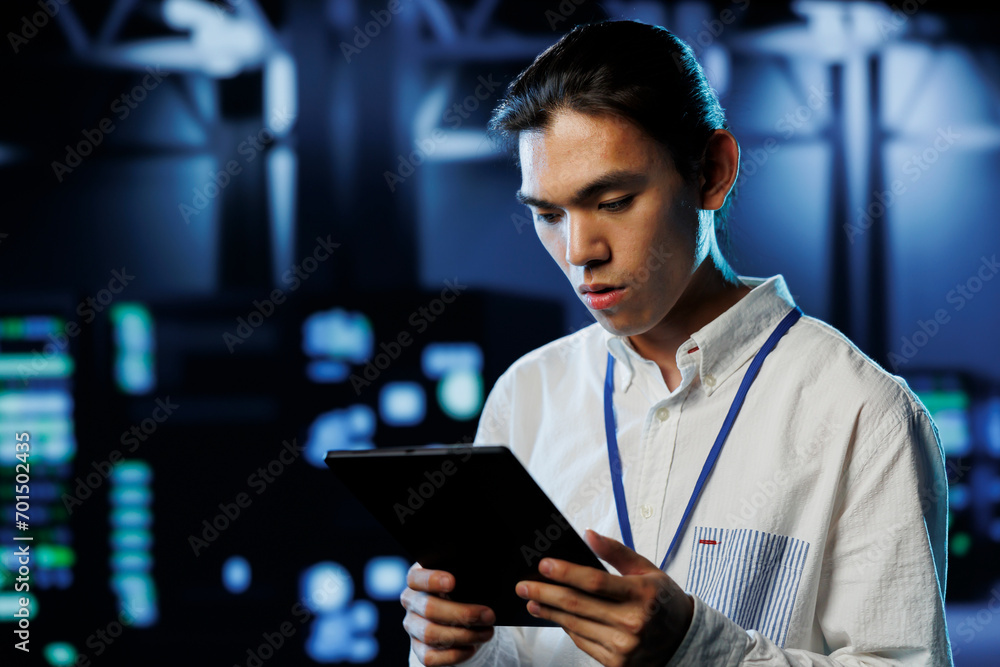 Poster tech support worker between server room equipment providing processing resources for businesses worl
