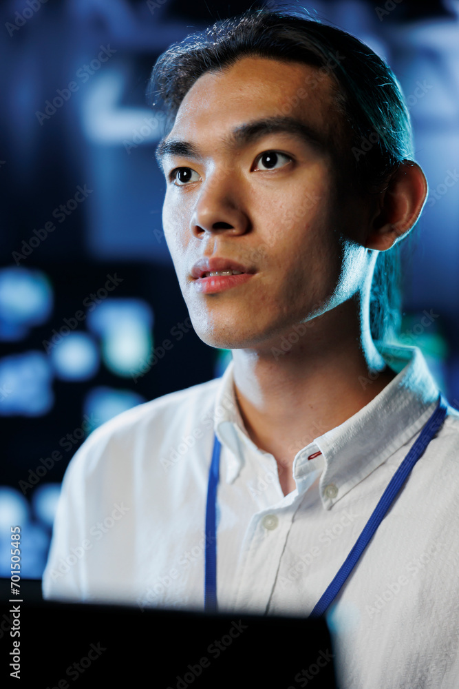 Poster portrait of technician between server hub clusters providing processing resources for businesses wor