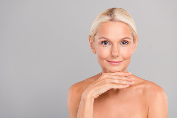 Portrait of retired woman touch chin plan plastic surgery rejuvenating procedure feel skin young...