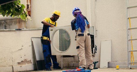 Licensed expert commissioned by client to work on out of order air conditioner, dismantling...