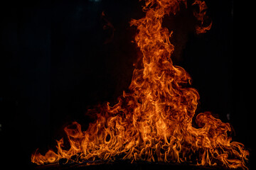 Blaze burning fire flame on art texture background.