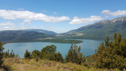 Naklejka na ściany i meble New Zealand lake landscape blue with. mountains in the back