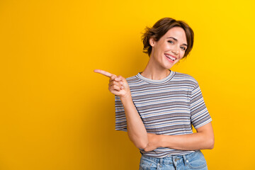 Photo of optimistic woman with bob hairdo dressed striped t-shirt indicating at sale empty space...