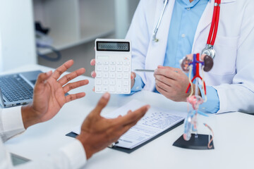 close-up of male patient consultation with doctor, explaining model of reproductive system, possibly discussing prostate cancer, cystitis, or urinary tract infection. - obrazy, fototapety, plakaty