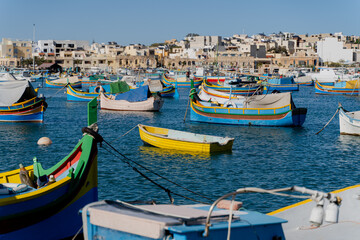 Fototapeta na wymiar Multi-colored fishing boats. Malta. Overall plan.