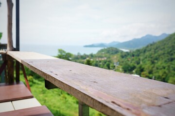 Empty surface of wooden table in cafe on the hill