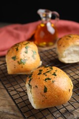Traditional Ukrainian bread (Pampushky) with garlic on baking grid
