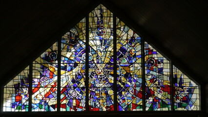 Fototapeta na wymiar shot of the beautiful window art in a religious Christian or catholic chapel 