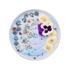 Obraz na płótnie Canvas Delicious smoothie bowl with fresh fruits, blueberries and flower isolated on white, top view