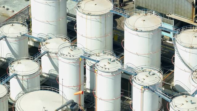 A diesel and biodiesel refinery is a facility that processes crude oil or renewable feedstocks to produce diesel fuel and biodiesel, meeting energy and environmental demands. Aerial view drone.
