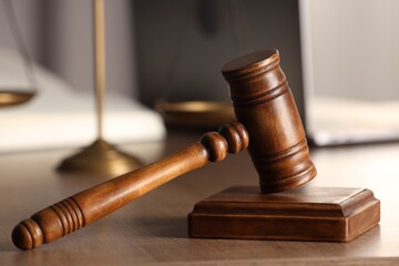 Law concept. Gavel on wooden table, closeup