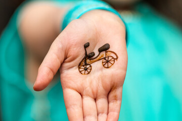 Obraz premium Bike henna tattoo on child's hand. Henna Art.