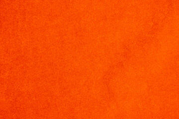 light orange velvet fabric texture used as background. silk color saffron fabric background of soft and smooth textile material. crushed velvet .luxury sun light tone for silk.