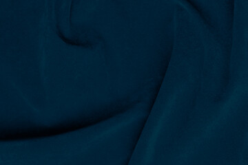 Dark blue velvet fabric texture used as background. silk color denim fabric background of soft and...