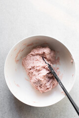 Beet Focaccia dough in a white bowl, process of making pink focaccia, beet dough rising in a white mixing bowl	