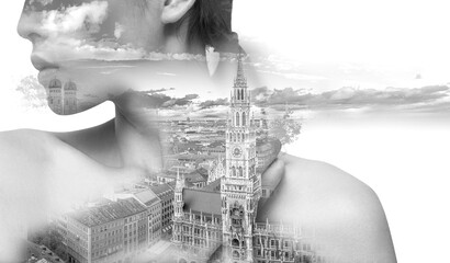 Double exposure of woman and cityscape in black and white