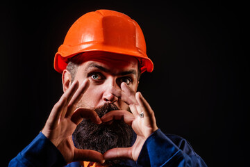 Builder worker. Handyman in hardhat. Builder foreman. Man in helmet studio portrait. Engineer...