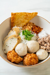 spicy small flat rice noodles with fish balls and shrimp balls without soup