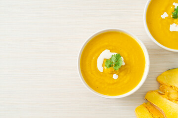 pumpkin soup in white bowl