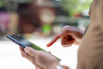 Social media marketing concept. Women hand using smartphone typing, chatting conversation.